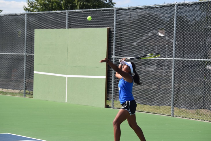 Sophomore Lily Ogden hits a serve at Chapman. Lily is the #2 singles player for the Chargers.